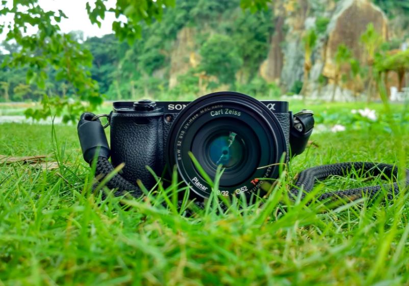 a camera placed on a grass