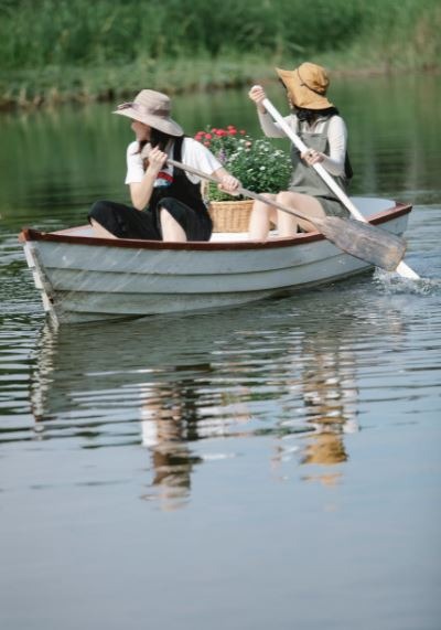 two women boating in the river