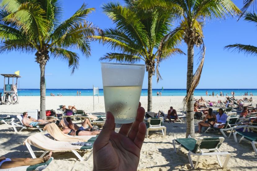 A-person-having-a-drink-at-the-beach-in-Mexico