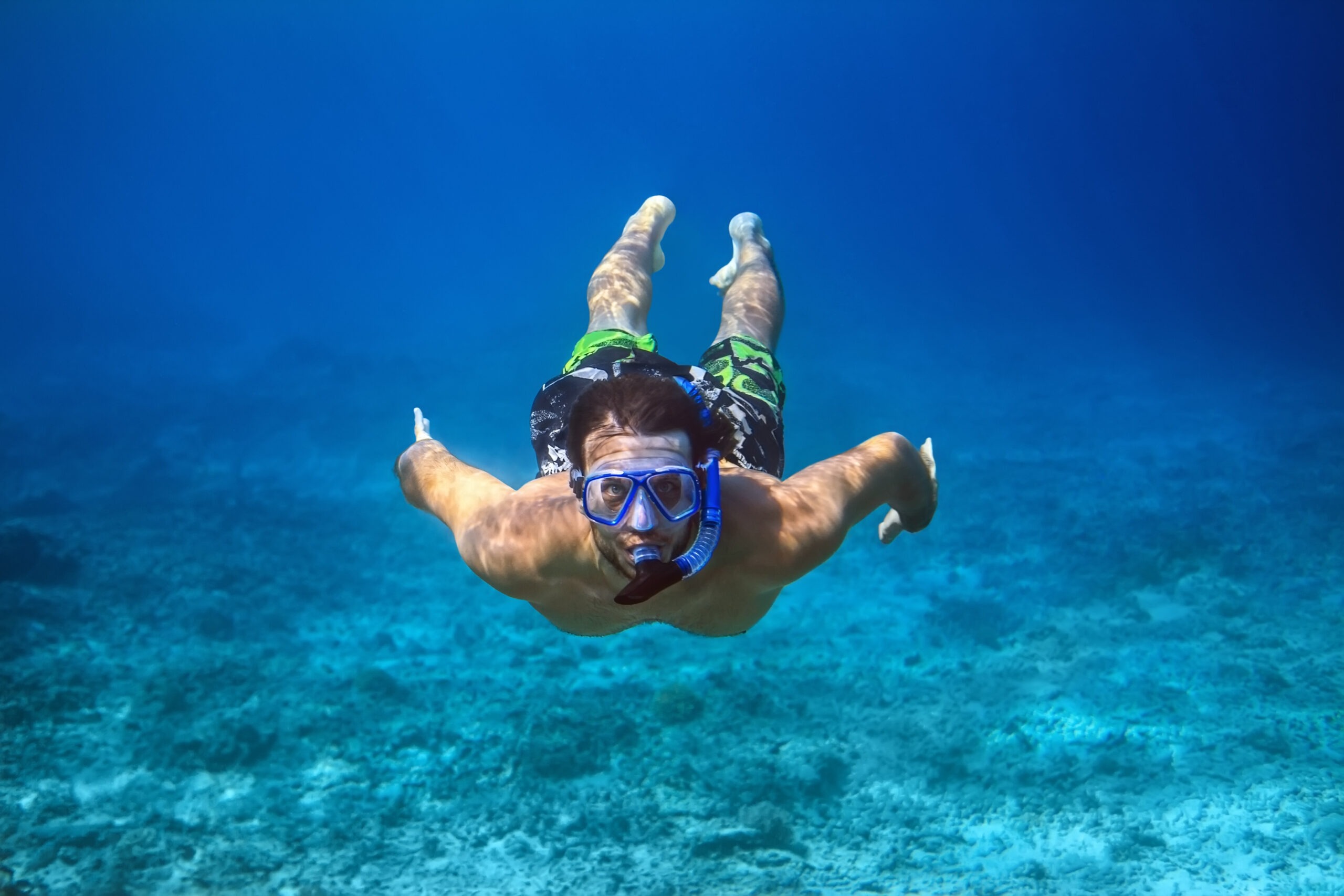 Underwater shoot of a young man snorkeling in tropical sea