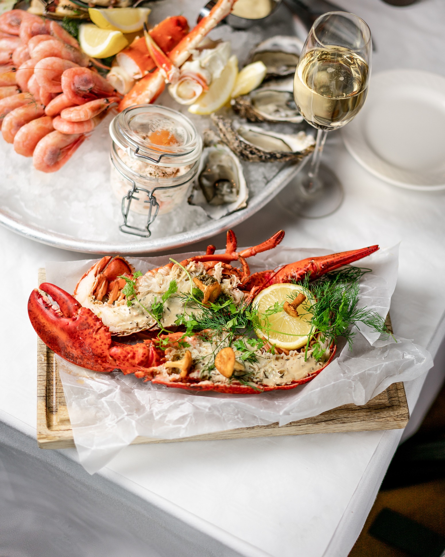 different seafood dishes on a white table